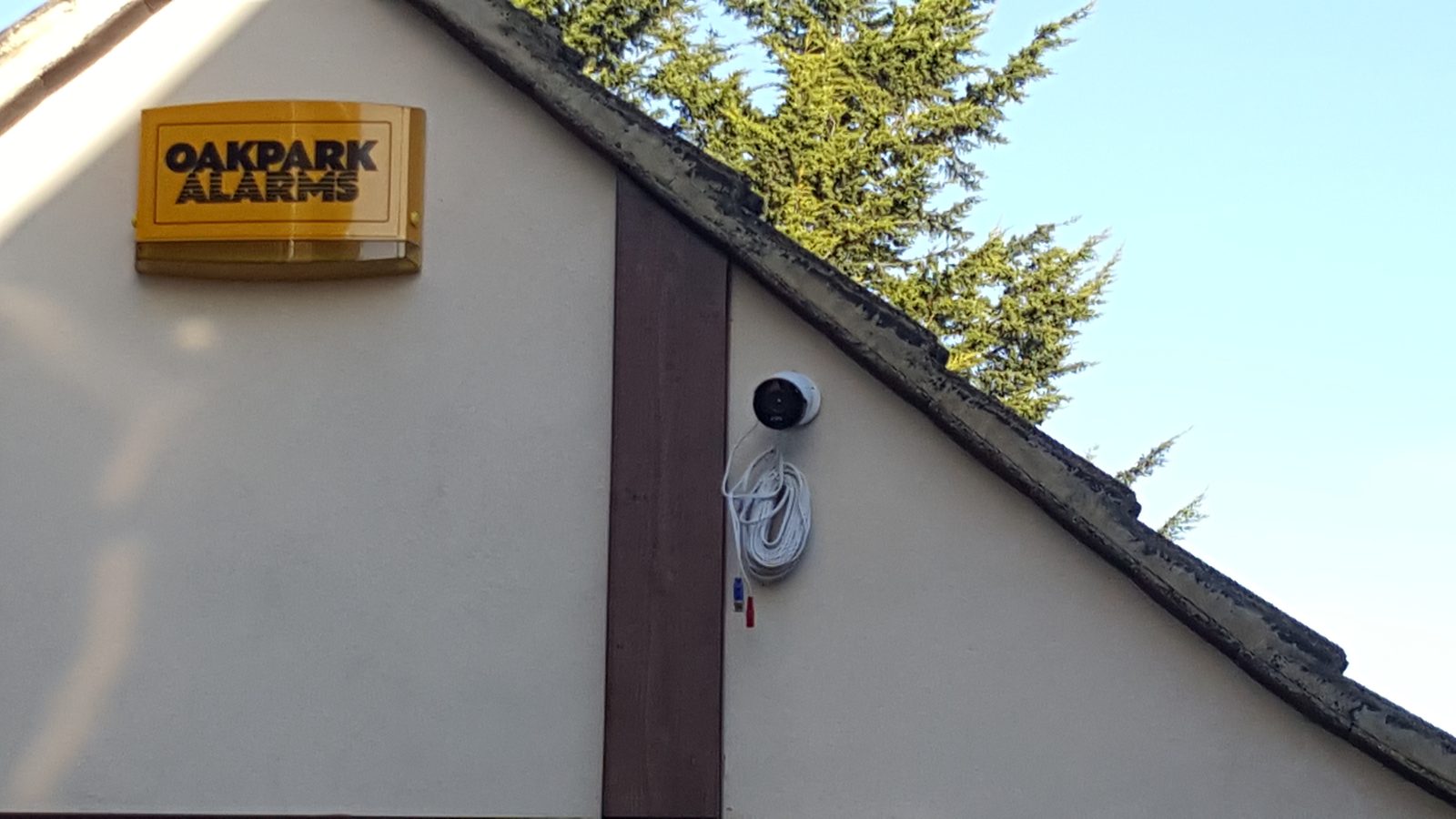 External intruder alarm bell box installed high on the property wall.