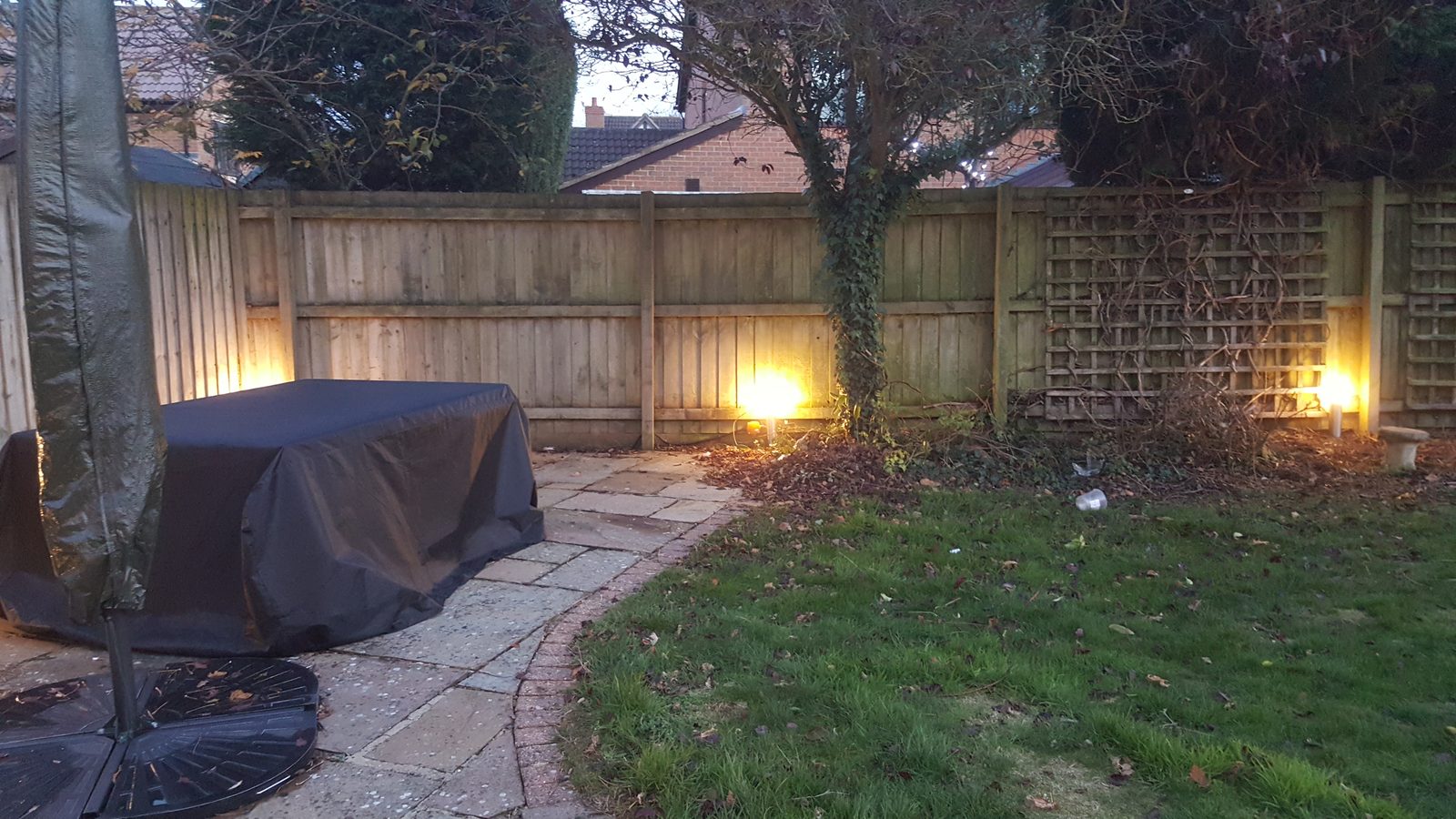 Garden and outdoor lighting installation at dusk.