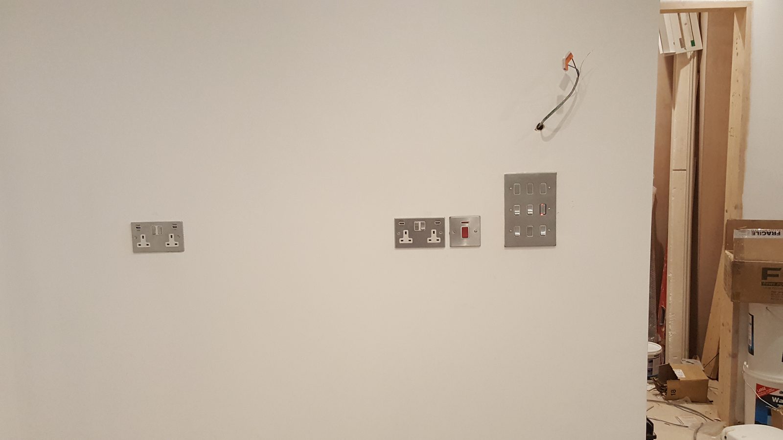 New sockets, switches and electrical outlets installed during room refurbishment works.